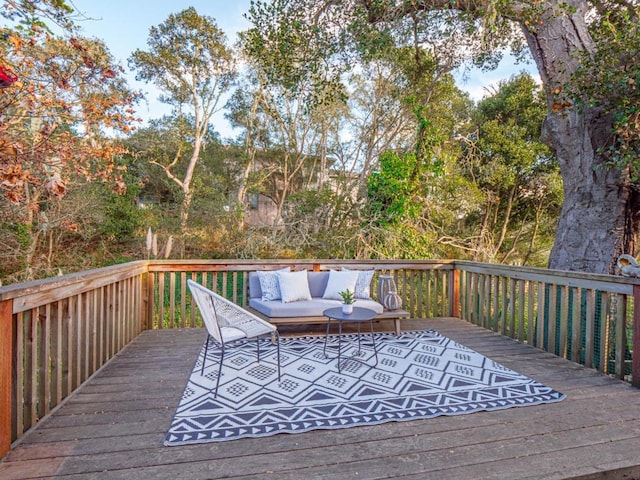 wooden terrace with outdoor lounge area