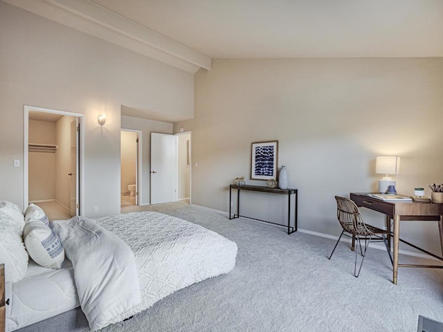 bedroom featuring high vaulted ceiling, beamed ceiling, carpet floors, a walk in closet, and a closet