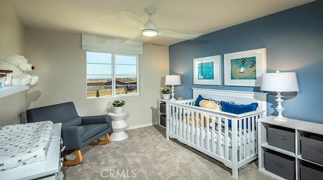 carpeted bedroom with ceiling fan