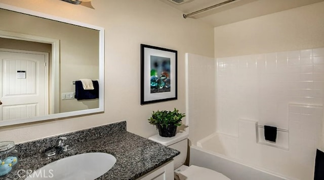 full bathroom featuring vanity, toilet, and shower / bath combination