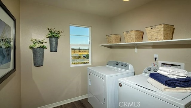 washroom with dark hardwood / wood-style flooring and washer and dryer