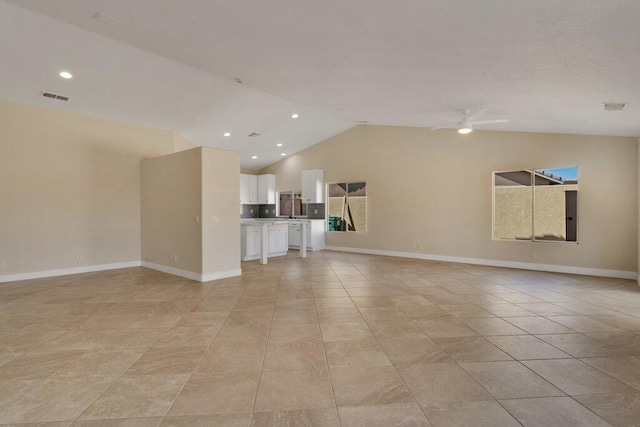 unfurnished living room featuring lofted ceiling, light tile patterned floors, and ceiling fan