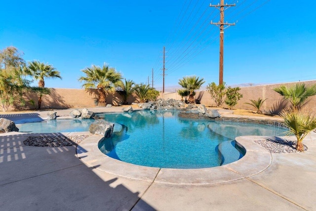 view of swimming pool featuring a patio