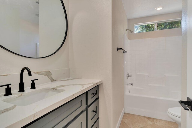 full bathroom with vanity, bathtub / shower combination, tile patterned floors, and toilet