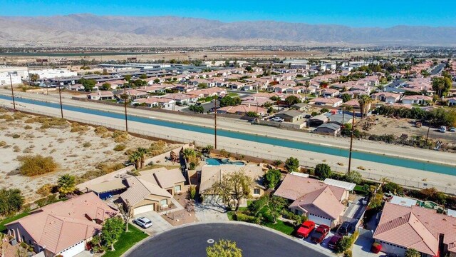 birds eye view of property with a mountain view