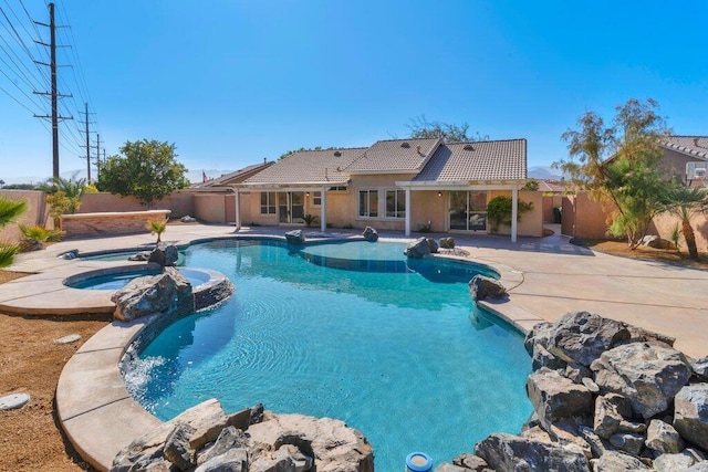 view of pool featuring an in ground hot tub and a patio area