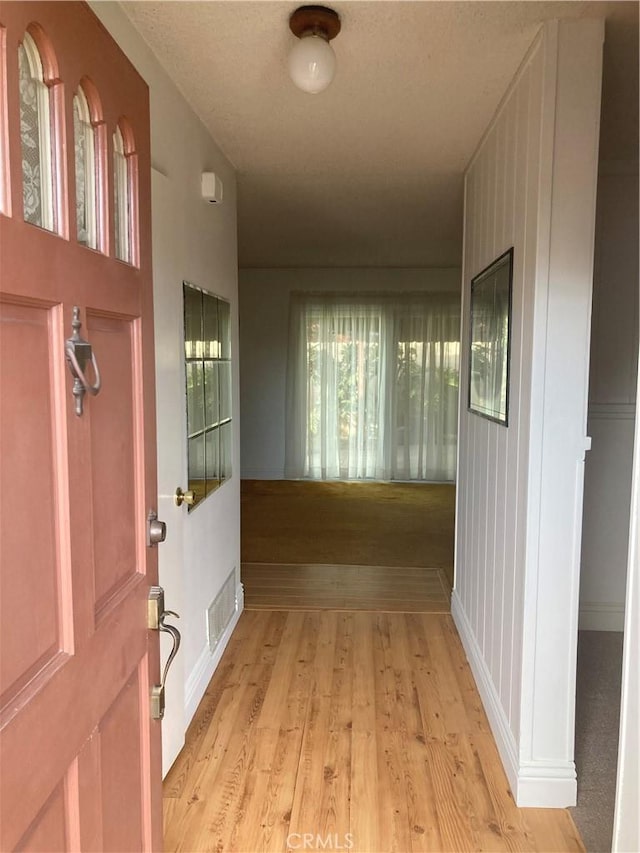 corridor featuring light wood-type flooring