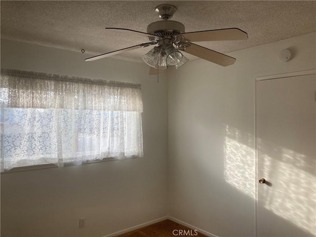 empty room featuring a textured ceiling