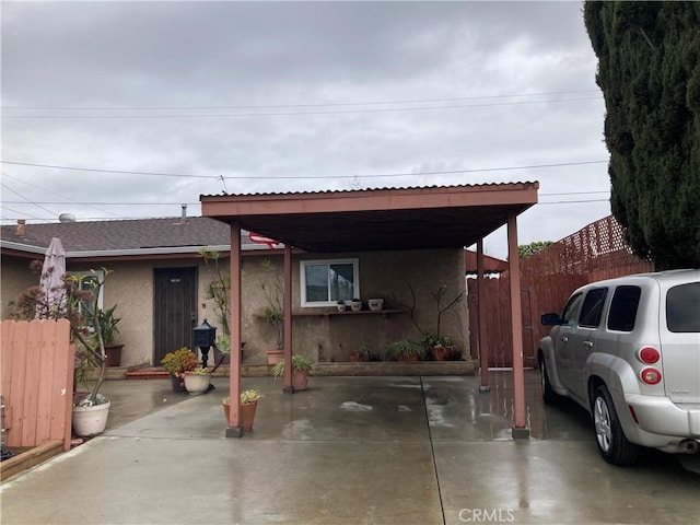 view of front of home featuring a carport