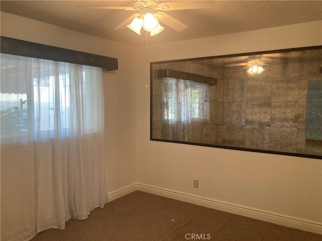 empty room with carpet and ceiling fan