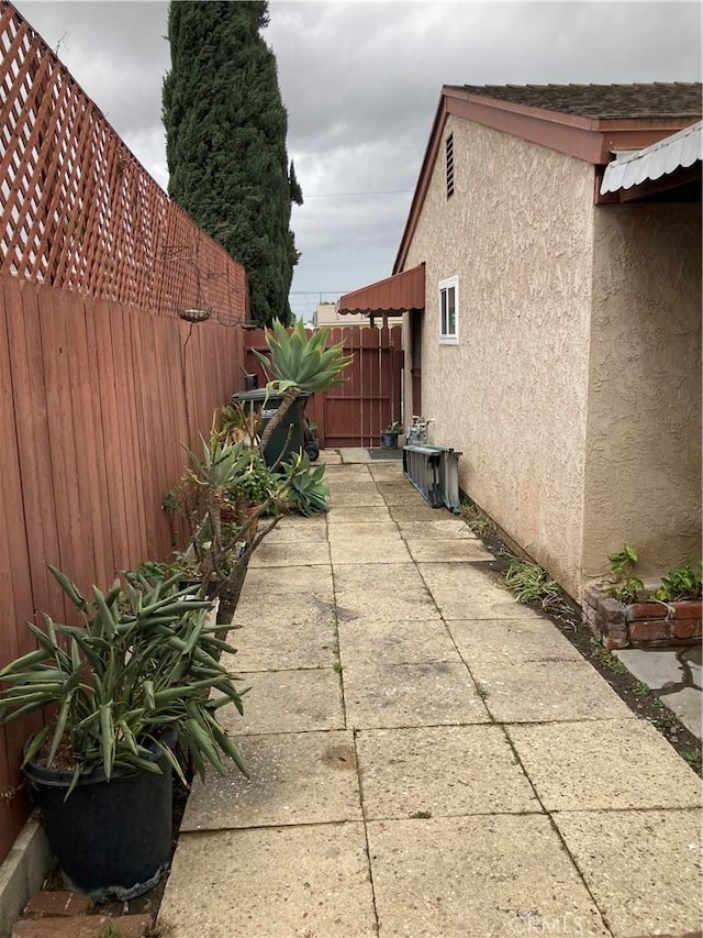 view of property exterior with a patio