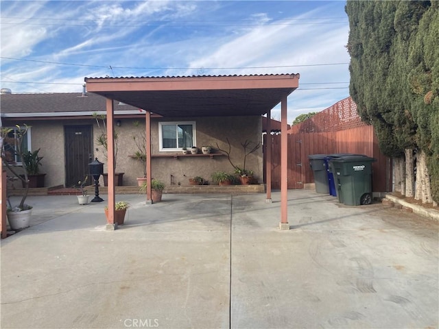 view of patio / terrace with a carport