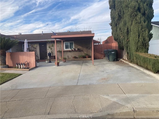 ranch-style house featuring a carport