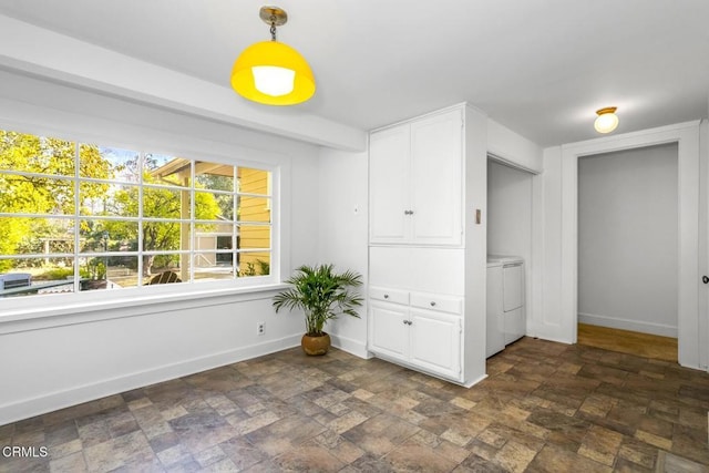 unfurnished room featuring washing machine and clothes dryer