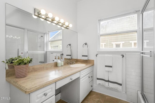 bathroom featuring tile patterned flooring and vanity