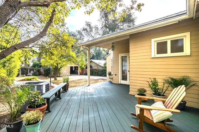 wooden deck with a shed