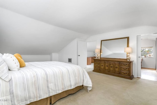 carpeted bedroom with vaulted ceiling