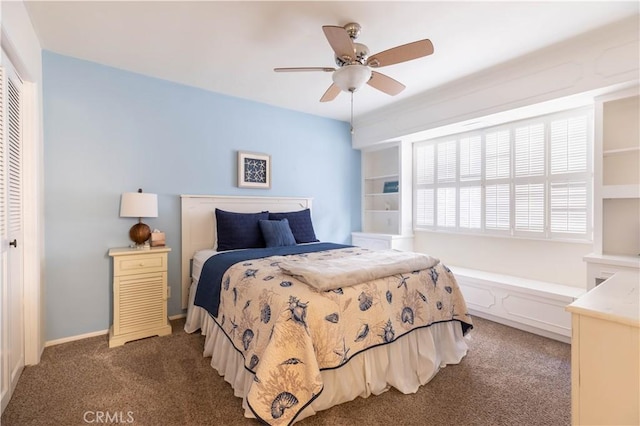 carpeted bedroom featuring ceiling fan and a closet