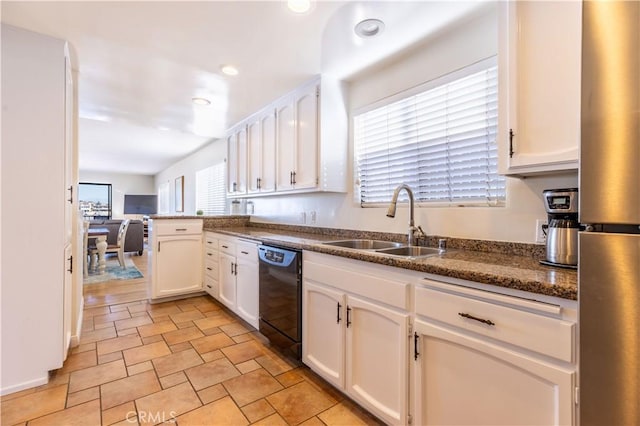 kitchen with black dishwasher, white cabinetry, a sink, and a peninsula