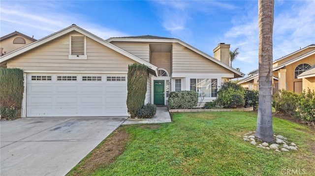 front facade featuring a garage and a front yard