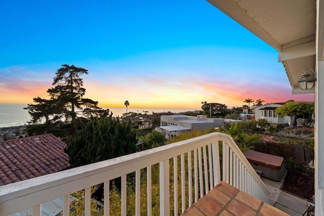 balcony featuring a water view