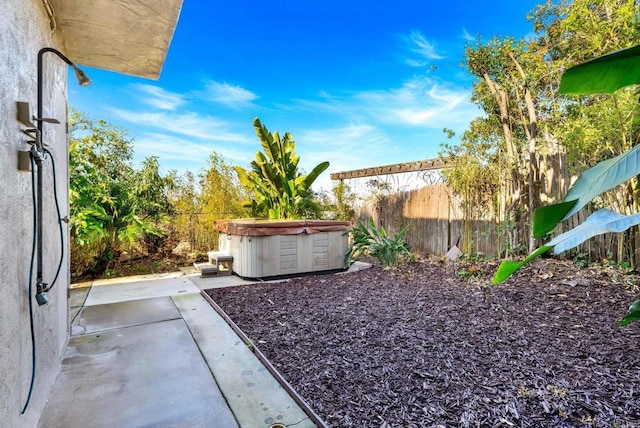 6130 Terryhill Dr, La Jolla, CA 92037 - fenced backyard featuring a hot tub and a patio