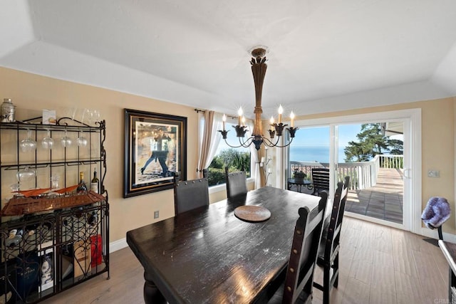 6130 Terryhill Dr, La Jolla, CA 92037 - dining area featuring a chandelier, plenty of natural light, baseboards, and wood finished floors