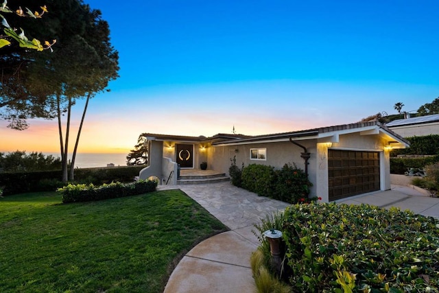 6130 Terryhill Dr, La Jolla, CA 92037 - view of front of house featuring a garage, stucco siding, a lawn, and concrete driveway