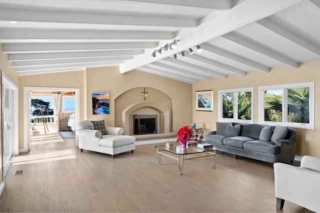 6130 Terryhill Dr, La Jolla, CA 92037 - living area with wood finished floors, plenty of natural light, and track lighting
