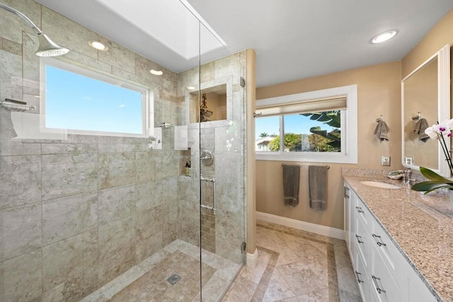 6130 Terryhill Dr, La Jolla, CA 92037 - bathroom featuring baseboards, tiled shower, vanity, and inlaid floor details
