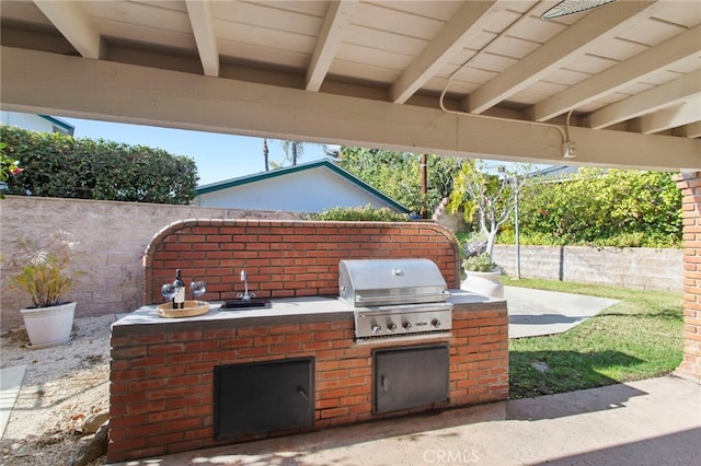 view of patio featuring grilling area and an outdoor kitchen