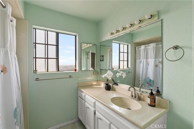 bathroom with vanity and a wealth of natural light