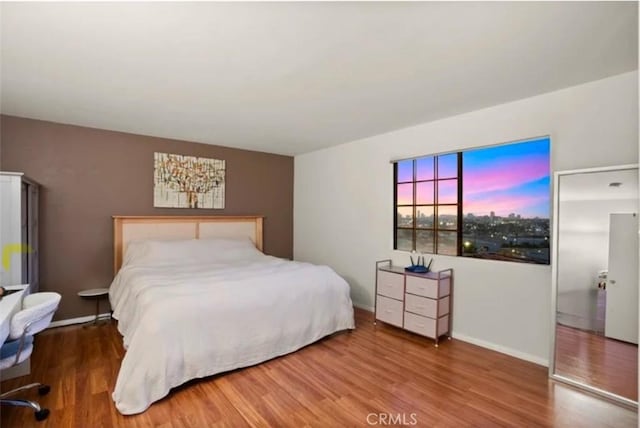 bedroom featuring hardwood / wood-style floors