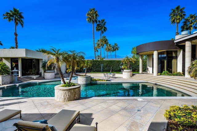 view of pool featuring a patio area