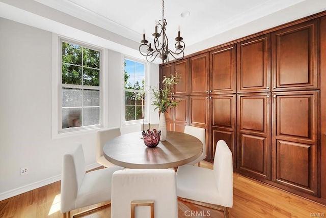 dining room featuring a chandelier and light hardwood / wood-style flooring