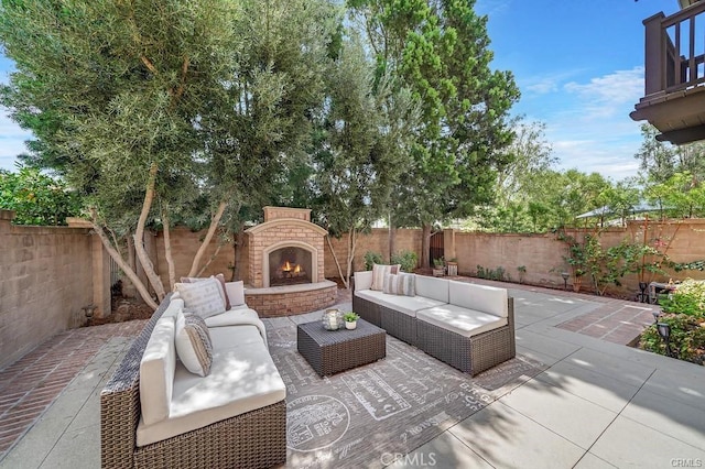 view of patio / terrace featuring an outdoor living space with a fireplace