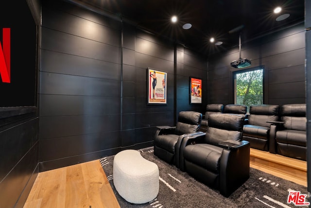 home theater room featuring wood-type flooring