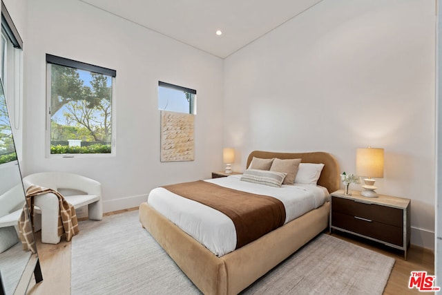 bedroom with light wood-type flooring