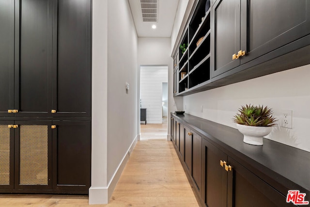 hall with light hardwood / wood-style floors