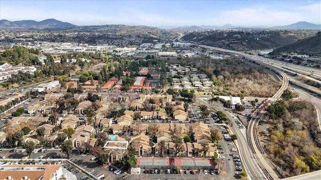 birds eye view of property with a mountain view