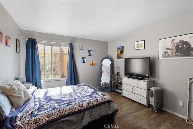 bedroom featuring dark wood-type flooring