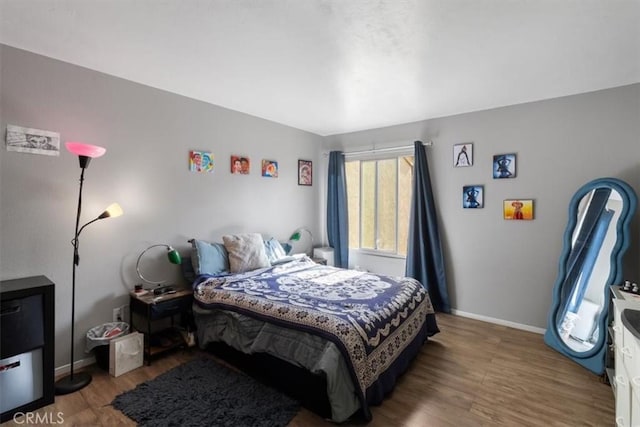 bedroom with hardwood / wood-style floors