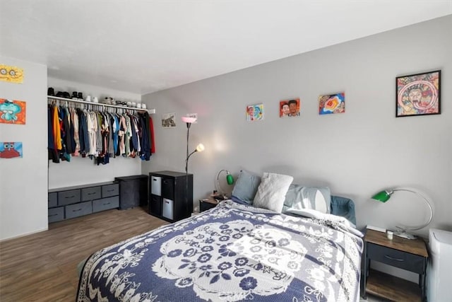 bedroom featuring dark wood-type flooring