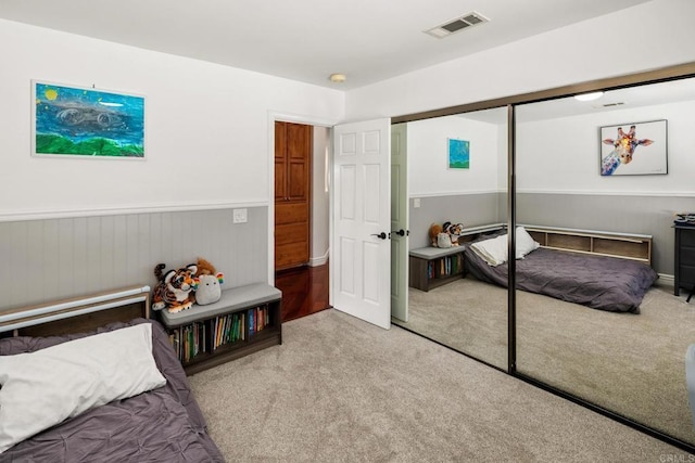 carpeted bedroom featuring a closet