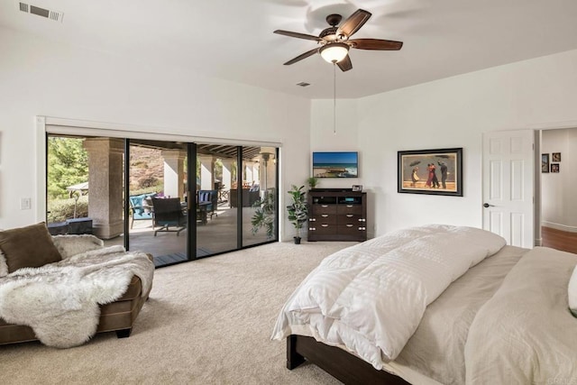 carpeted bedroom featuring access to exterior and ceiling fan