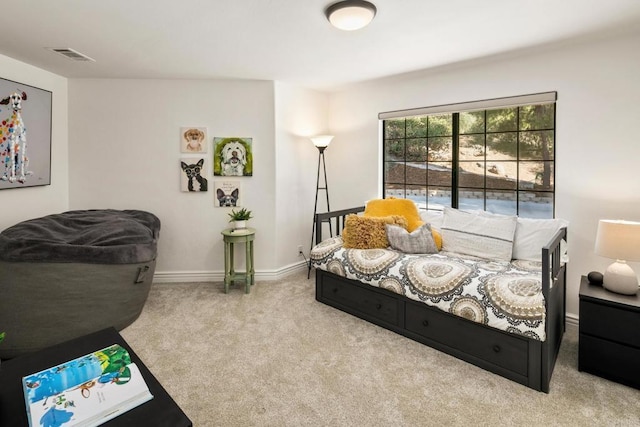 bedroom featuring light colored carpet