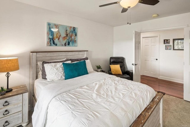 bedroom with ceiling fan and wood-type flooring