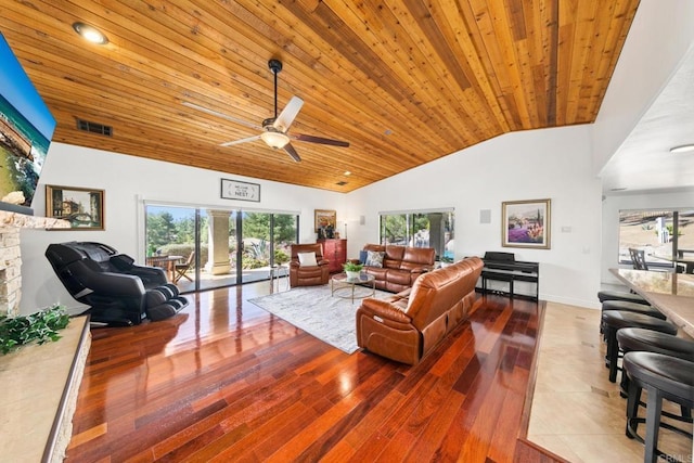 living room with ceiling fan, wood-type flooring, high vaulted ceiling, and wooden ceiling