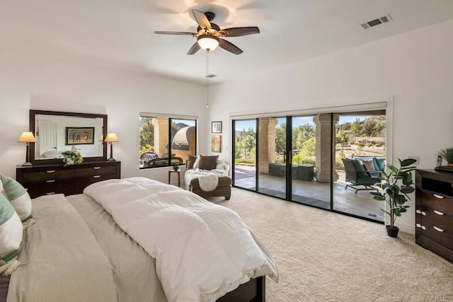 carpeted bedroom with ceiling fan and access to outside