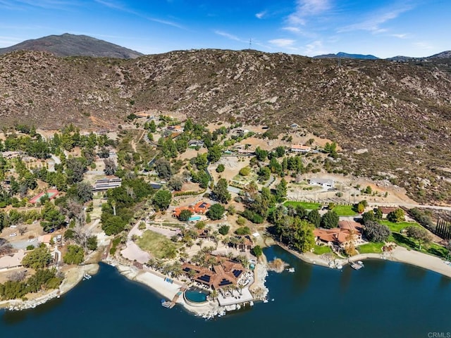 drone / aerial view with a water and mountain view